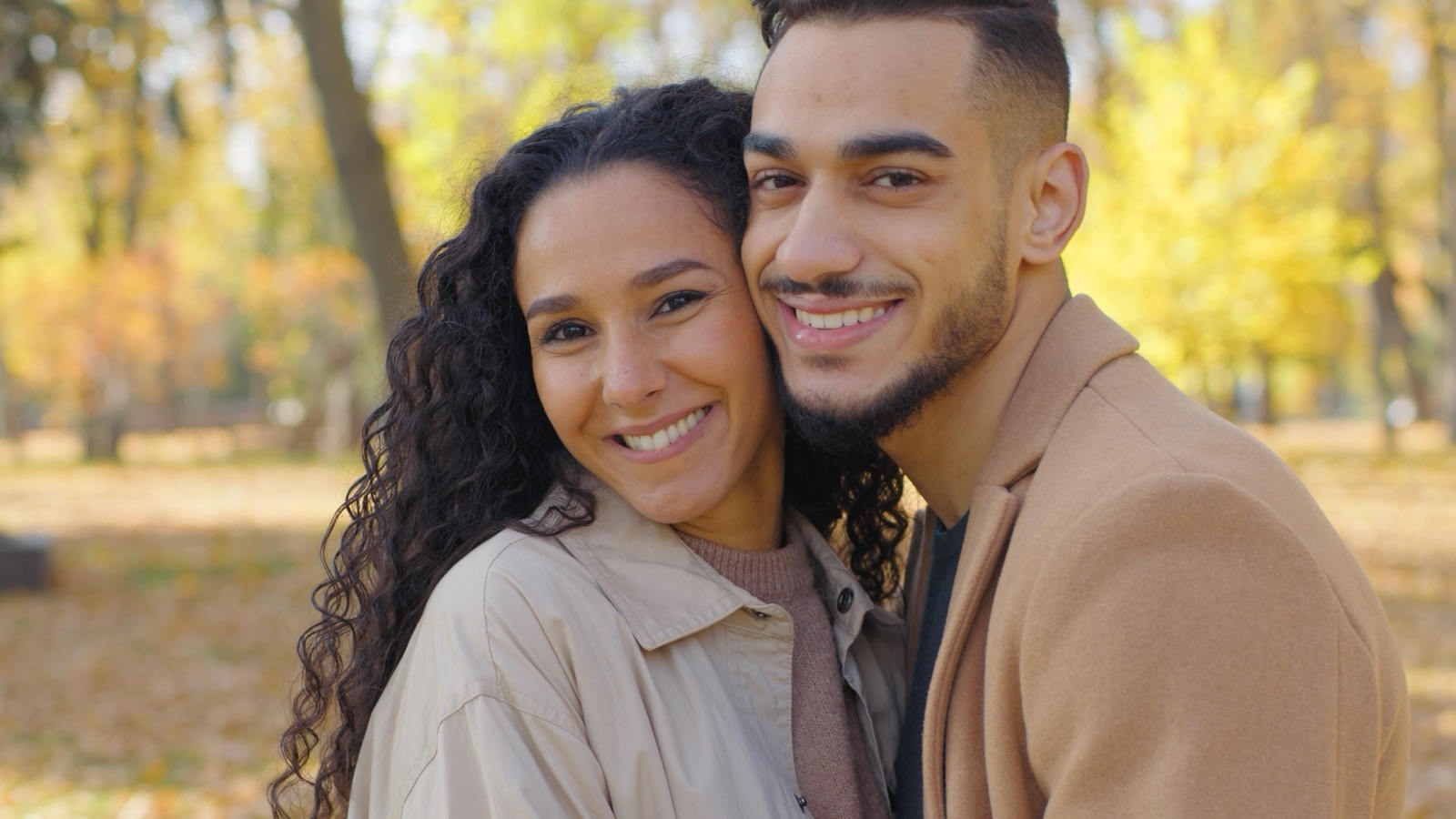 Young couple smiling together outdoors